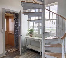 Inside elevator and spiral staircase to access your penthouse entertainment area.
